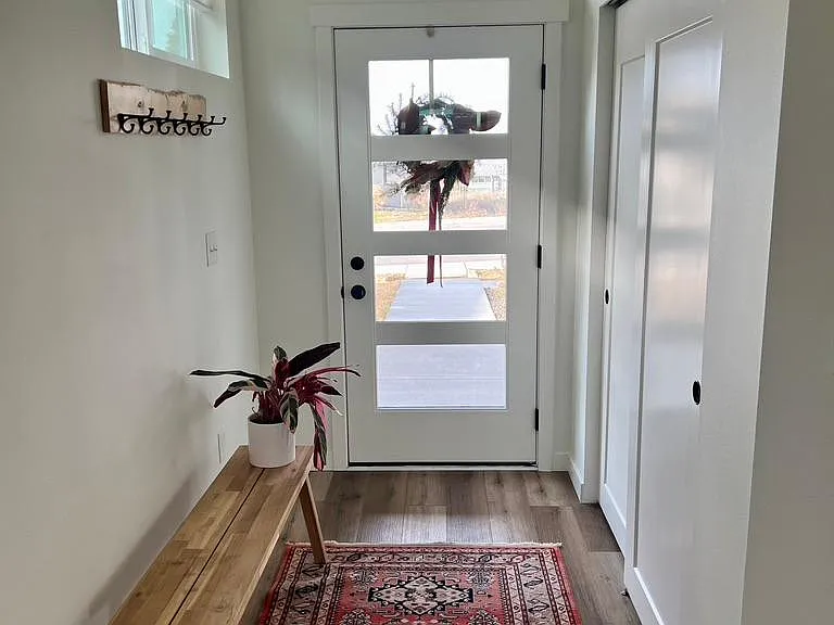 Entryway with closet.