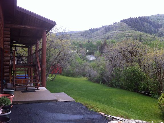 Big porch, nice yard, trees.