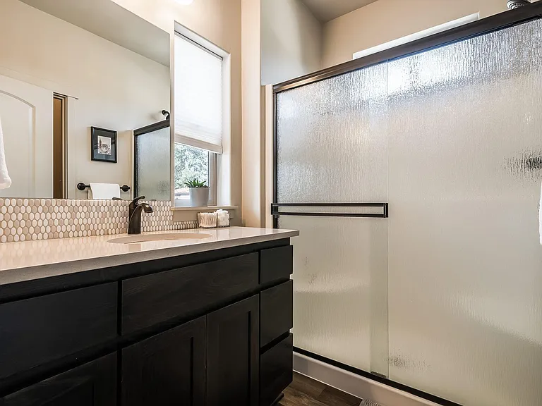 Primary bathroom with separate toilet area.