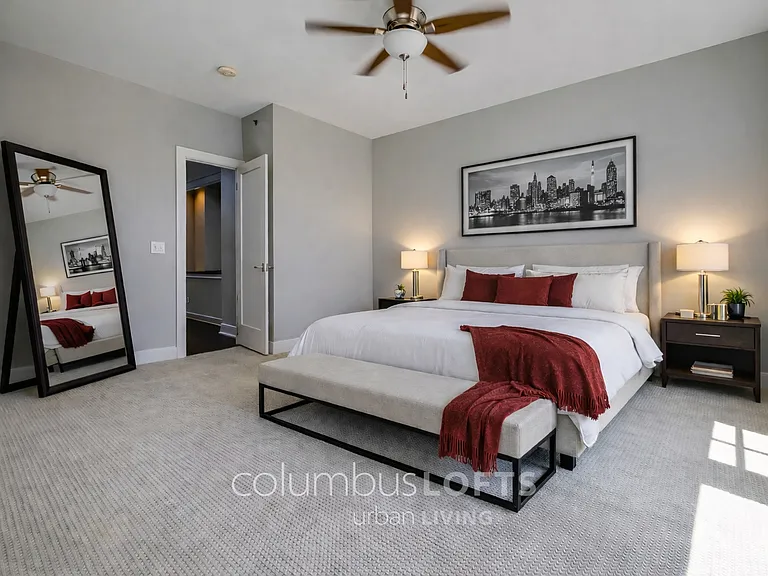 master bedroom. windows to right overlook private balcony. door to left goes into main living room next to powder room.