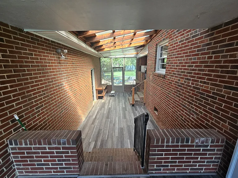 Enclosed porch with LVP flooring.