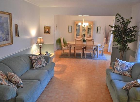 Living room and dining room standing in the foyer