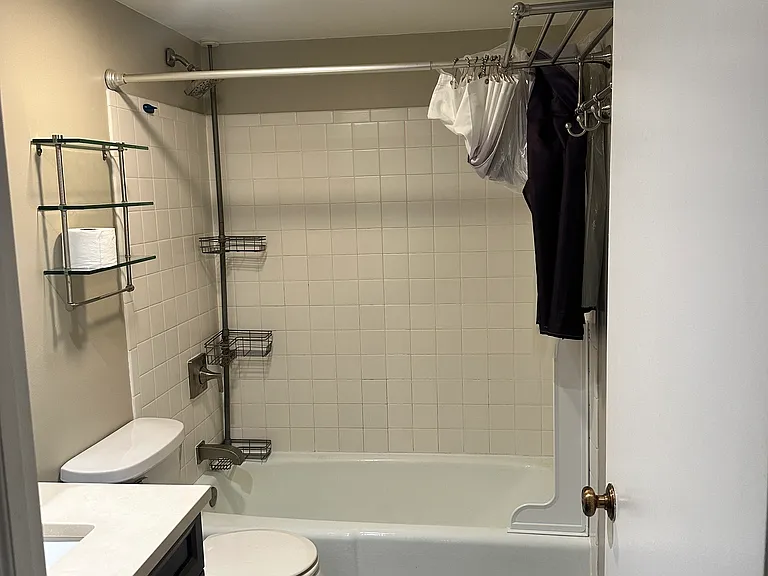 Shower with tub with plenty of space for items
