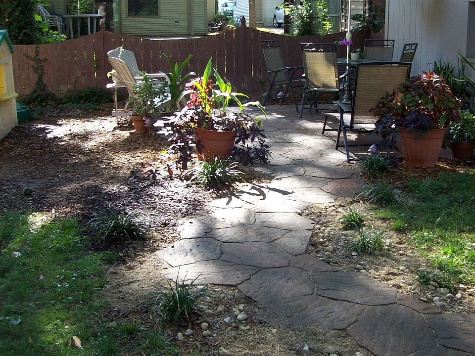 Patio in fenced back yard, with outdoor speakers