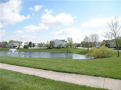 West side angle of rear of home with nice spacious backyard.