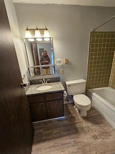 Bathroom, granite vanity top and tile shower walls.