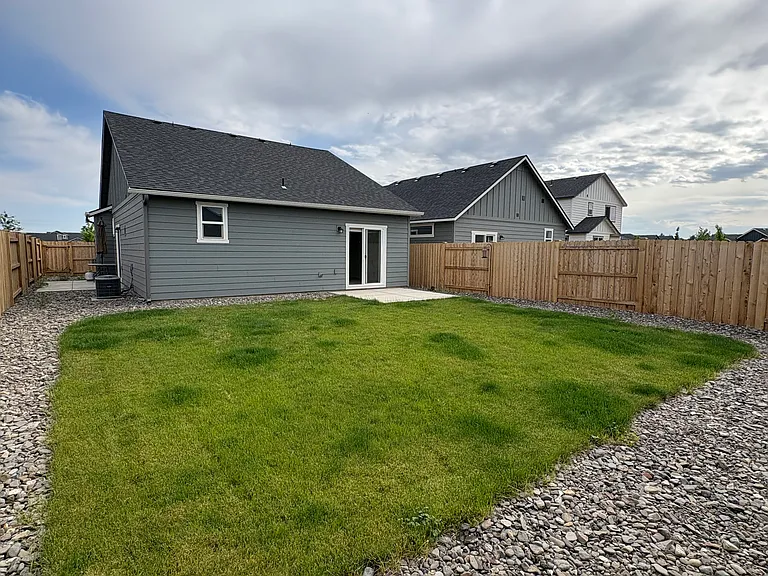 Back yard perfect for raised garden beds along fence.