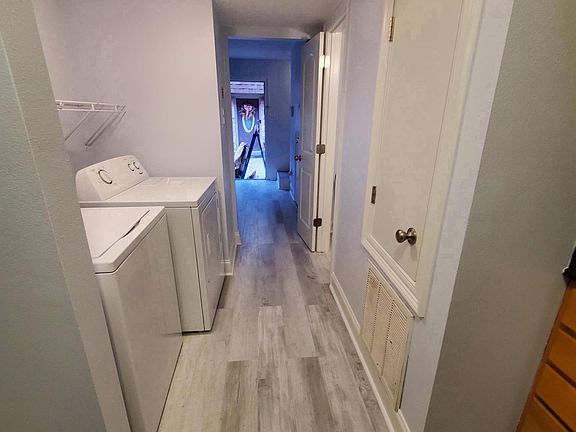 VIEW FROM KITCHEN TO FRONT DOOR
NEW FLOORING AND PAINT
