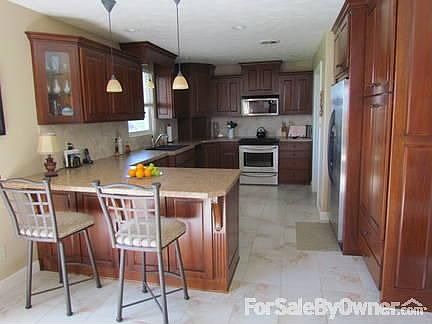 Kitchen
						:
						Custom solid cherry cabinets.