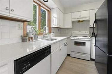 Kitchen with updated appliances and just refinished cabinets