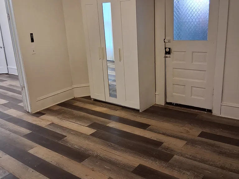 front bedroom door that opens to mudroom