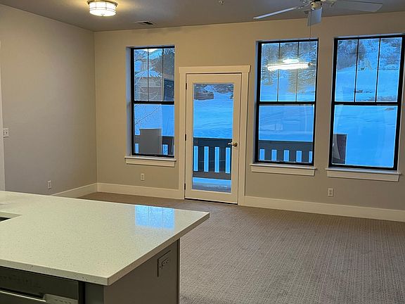 Beautiful tall windows back up to open space with Mountain View