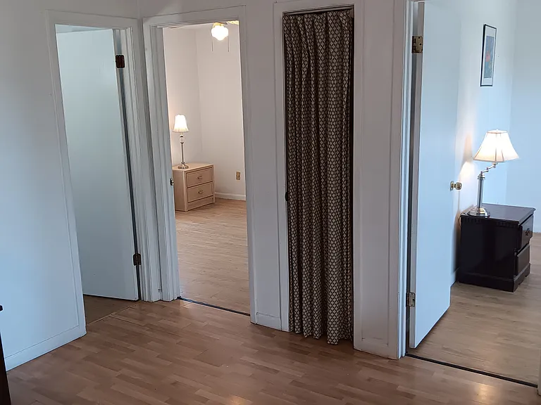 living room facing bathroom and bedrooms