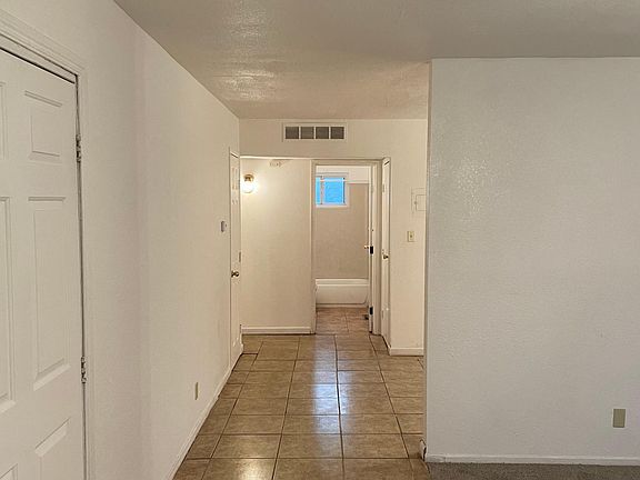 Front door looking toward first bathroom.