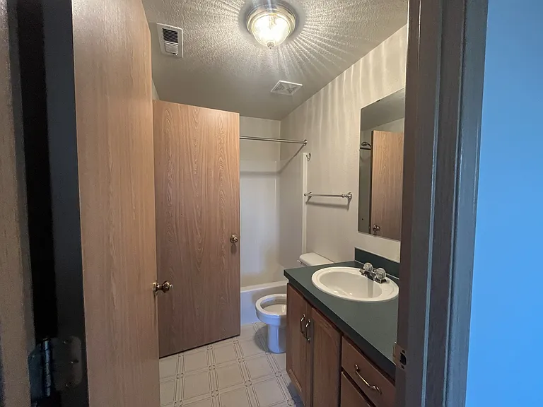 Upstairs bathroom has access from hallway and back side bedroom
