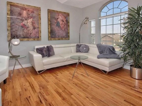 Main floor formal living room with hard wood floor