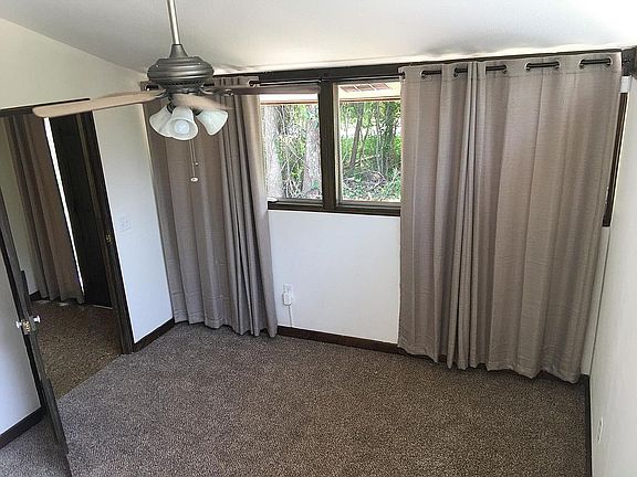 Bedroom with Carpet and Light-Blocking Drapes