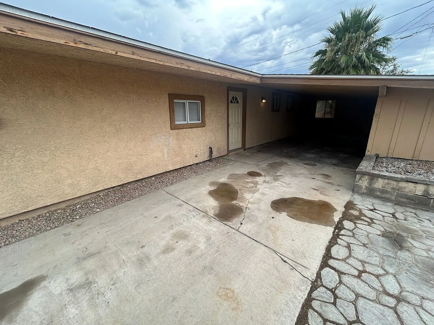 Single story home with large backyard and huge carport with plenty of storage. — Photo 2