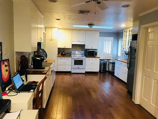 Kitchen nook provides space for home office, playroom, or den
