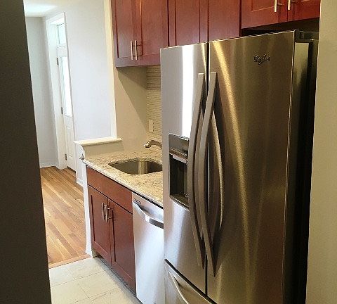 Kitchen leading into dining area with terrace