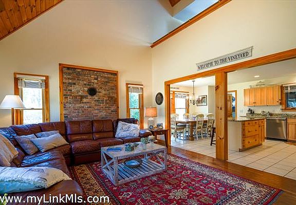 Living room with wood stove connection.