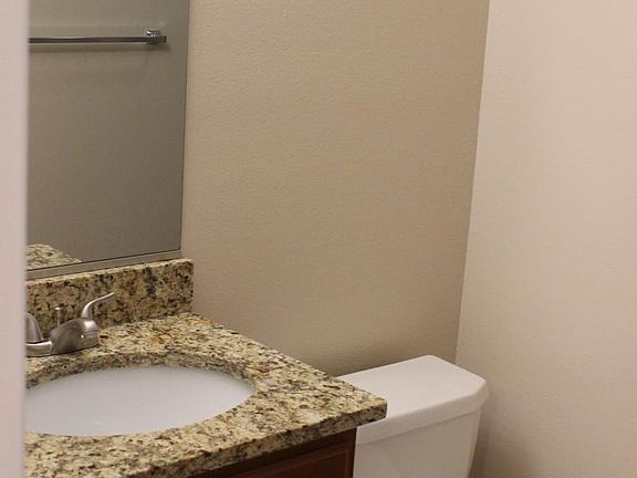 1 of 2 bathrooms, granite counter, bathtub, tile floors