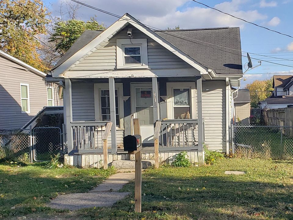 Front of house. 2 1/2 car block garage out back.