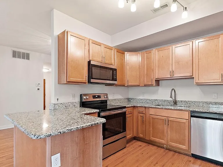 Beautifull kitchen, granite countertops, stainless steel appliances, open to dining room and living room
