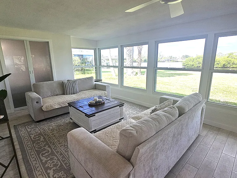 Enclosed Florida room with view to canal