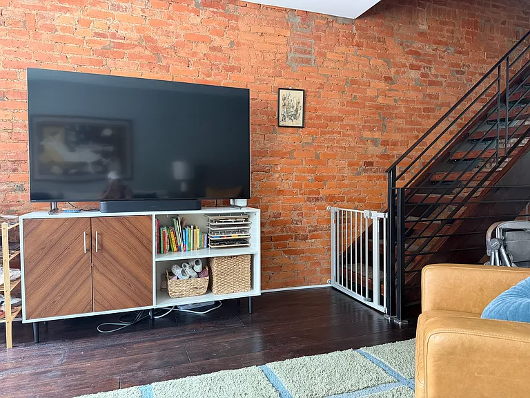 Living room (steps upstairs, all stairwells in the house are floating steps as pictured)