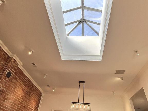 Antique sky light above great room fills the room with natural light
