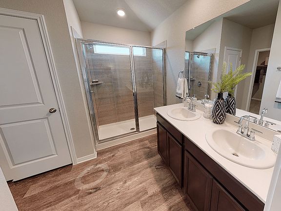 Relax and unwind in the luxurious primary bathroom.