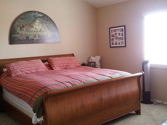 Master bedroom with walk in closet and plantation shutters