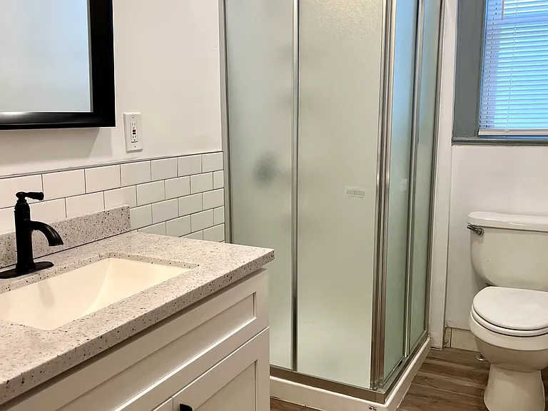 newly renovate bathroom with standing shower