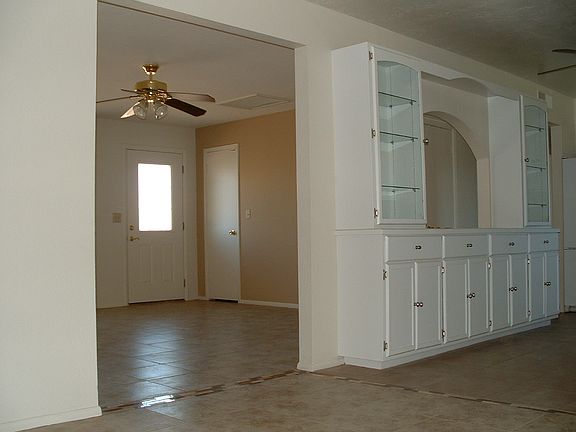 Entry Area, with open pass true from Kitchen Area.