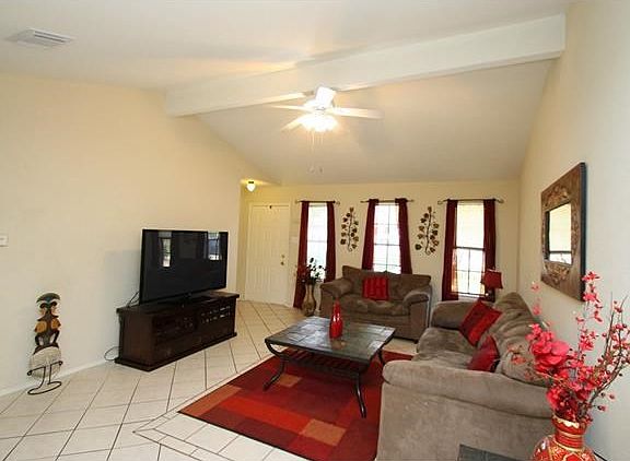 Perfect spot to relax and watch some television. The height of the ceiling makes the room feel larger.