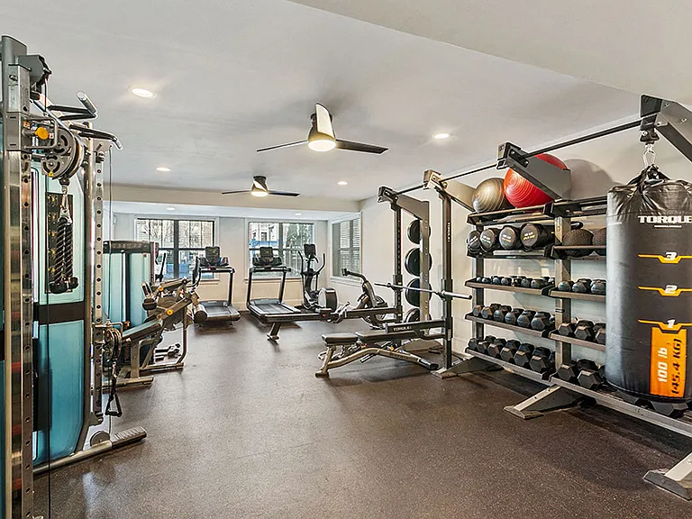 24-hour fitness center with cardio equipment and weight equipment