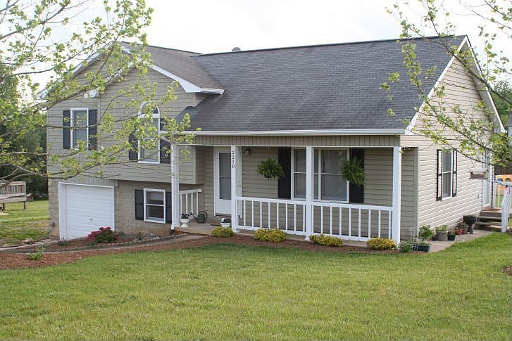 Newly landscaped front yard. Fresh Trim paint.