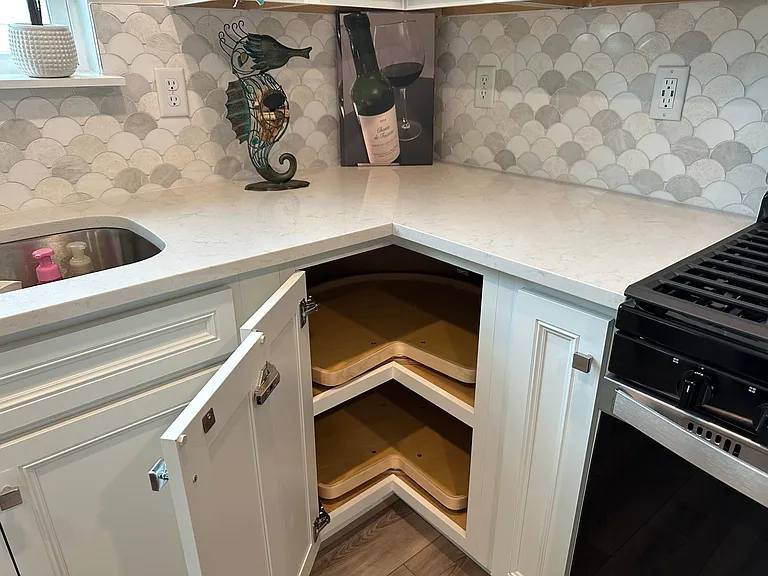 All kitchen cabinets have slide outs and Lazy Susan. Gas stove for cooking, microwave, dishwasher and refrigerator washer and dryer included.