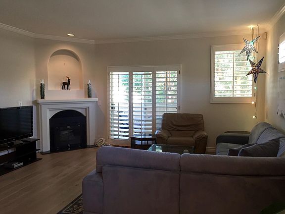 Main Level - Living Room with Gas Fireplace & Balcony