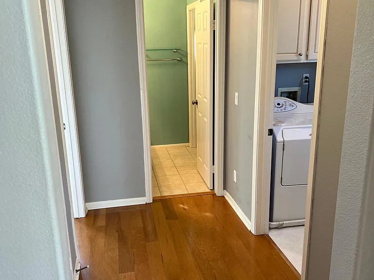 hallway near loft with laundry(right) and bedroom 3 (left) and linen closet (left) and bedroom 3 bathroom (straight ahead)