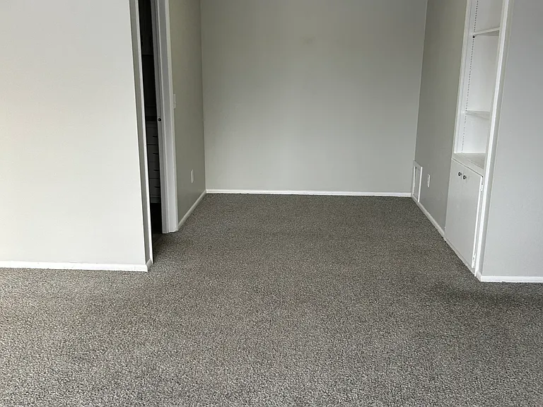 Dining area with built in shelf & cabinet.