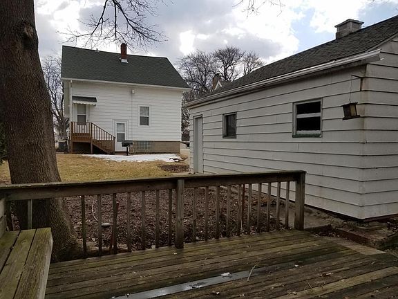 View from back deck, showing entrance to unit. Door on left up the stairs.