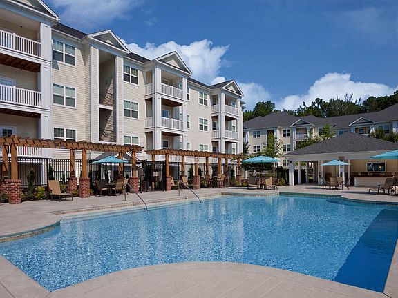 Soak in the sun at our expansive saltwater swimming pool with outdoor TV and cabana