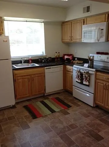 Rustic Village Apartments & Townhomes — Photo 9