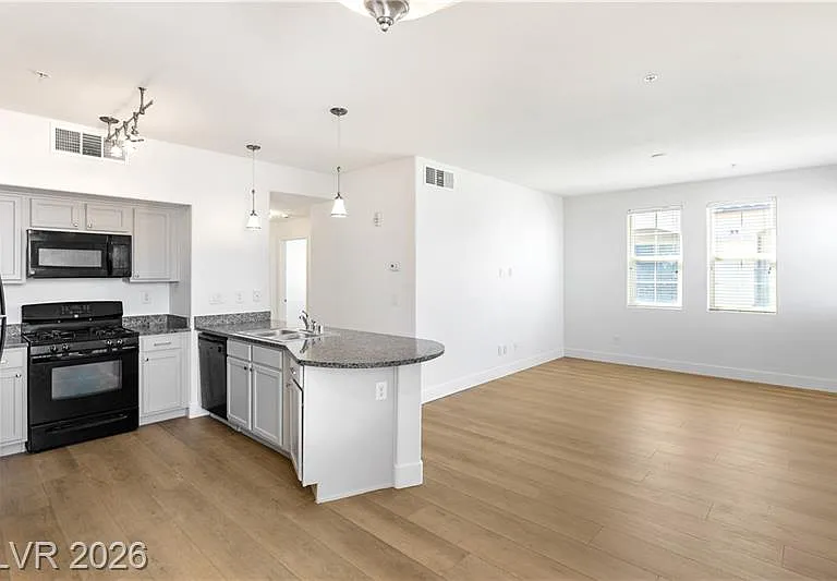 Spacious kitchen with breakfast bar and huge and bright living room