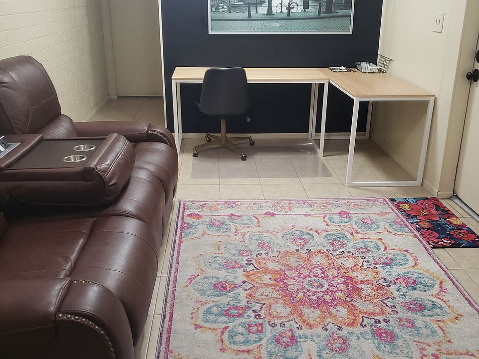 Furnished living room and study area.