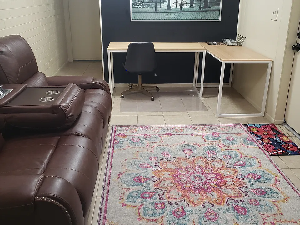 Furnished living room and study area.