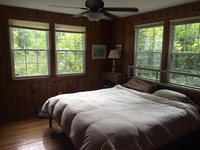 Master BR King sized bed. Beautiful pine wood creates a relaxing feeling.