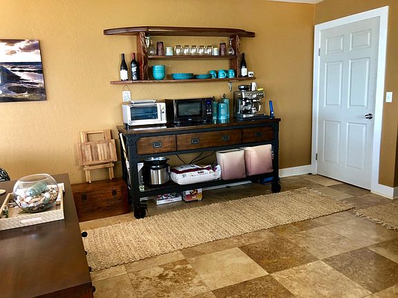 Shelving and wide industrial table included.